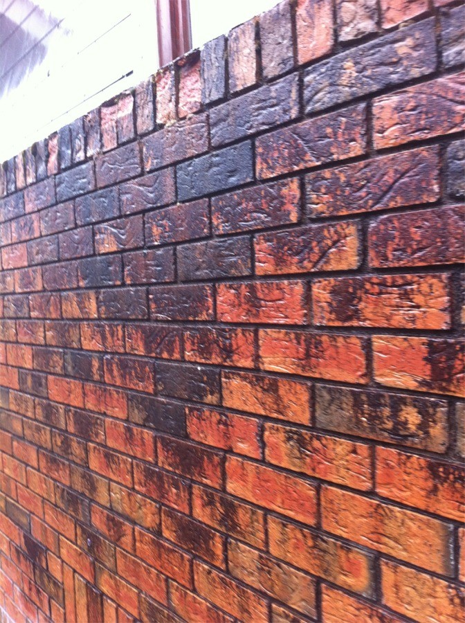 Detail of apartment wall - showing ingrained dirt and black mold on apartment block walls before cleaning by Pro Wash, Ireland