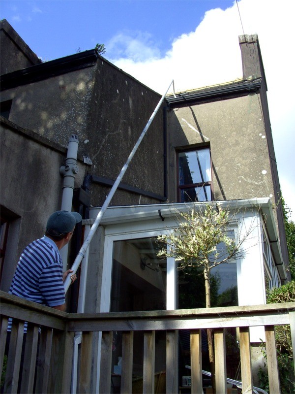 Gutter cleaning using advanced long pole technology with soft washing gentle cleaning action -   by  Pro Wash.ie, Cork, Ireland