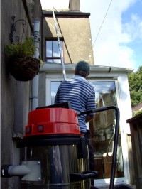 Gutter cleaning using advanced long pole technology with soft washing gentle cleaning action -   by  Pro Wash.ie, Cork, Ireland