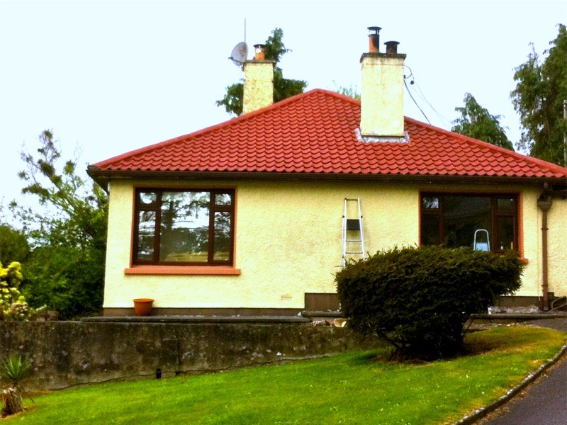 After treating, cleaning and painting the roof of a house terracotta  in Cork by Pro Wash.ie, Roof treatment specialists, Ireland
